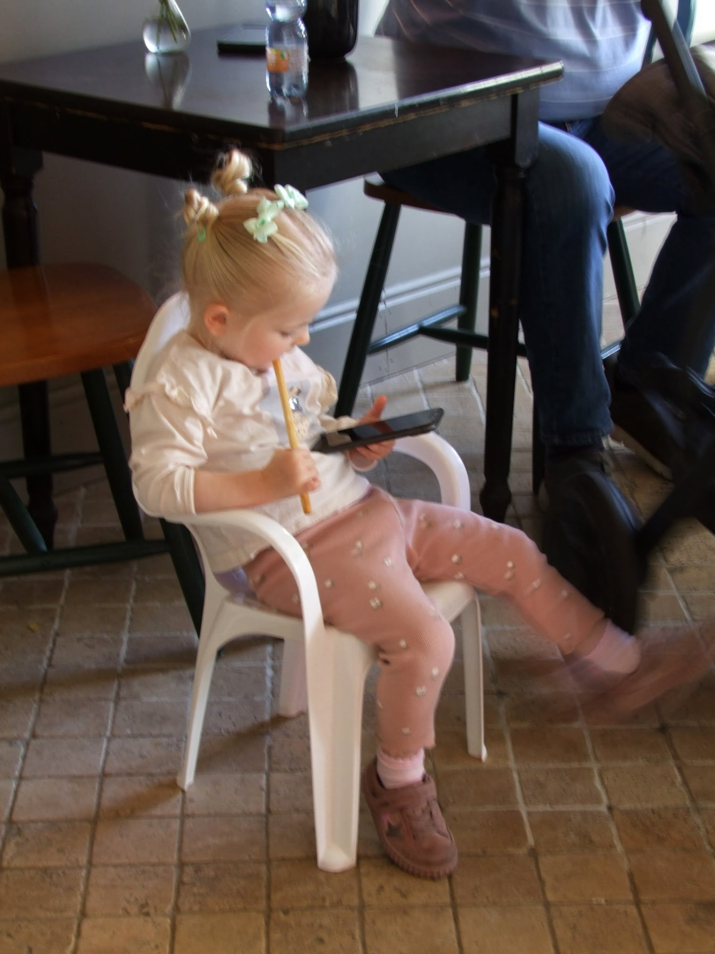 A little one with a drink at Cupán C