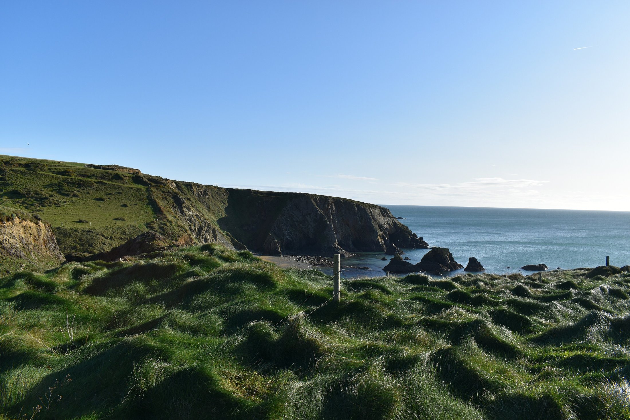 Cliffs, cove and sea stacks on the Copper Coast near Bunmahon, County Waterford